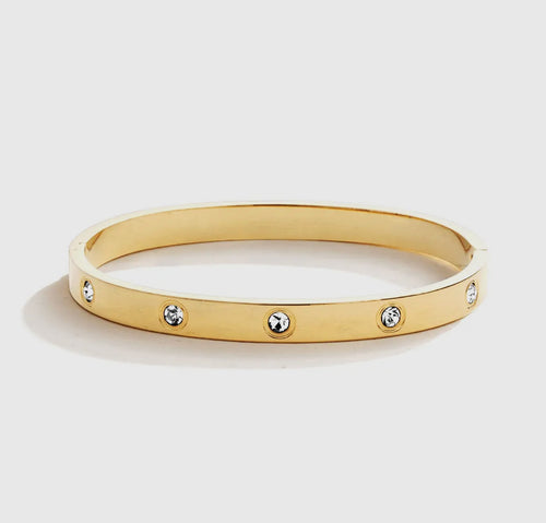 Gold hinged bracelet with embedded rhinestones.