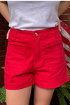 Model is wearing a red cotton twill short with front and back patch pockets and 4" inseam. 