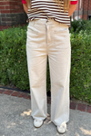 model is wearing a cotton twill pant sand color